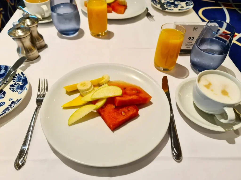 Cruising with Danny and Peter, Holland America Line, Rotterdam, Atlantic Ocean, Sea Day | Indonesian Rijsttafel at Sea served at the Tamarind restaurant aboard the Rotterdam cruise, showcasing vibrant dishes including Soto Ayam Madura, Nasi Goreng, and Pork Sate, alongside a Wasabi martini and Jalapeño martini, highlighting the unique culinary experience and ambiance of specialty restaurants on the cruise.