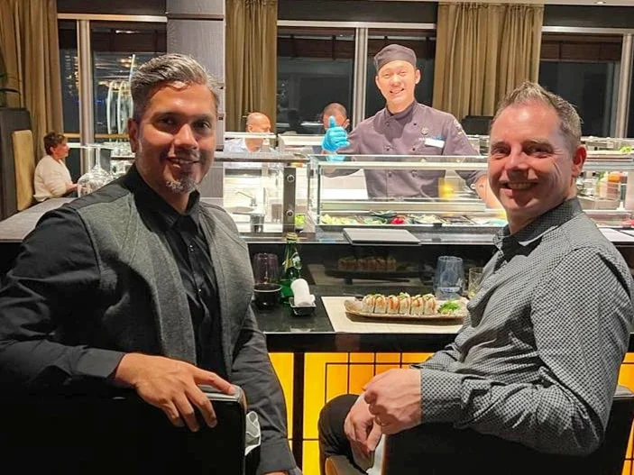 Cruising with Danny and Peter, Holland America Line, Rotterdam, Atlantic Ocean, Sea Day | A luxurious Sushi night MS Rotterdam experience aboard Holland America Line, featuring a variety of fresh sushi dishes like Hamachi, scallop ceviche, seared albacore tuna, and fried soft shell crab sushi, accompanied by cocktails at the Oceanview sushi restaurant with stunning ocean views, showcasing the Best sushi at sea during a memorable Sushi dining aboard MS Rotterdam.