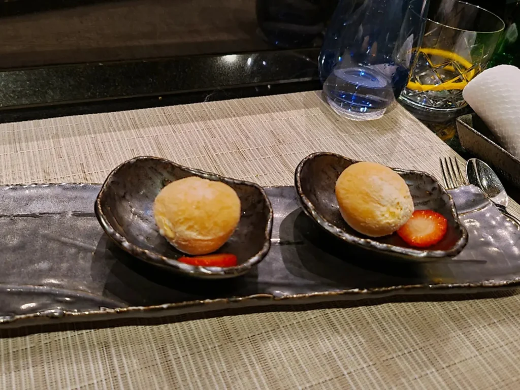 Cruising with Danny and Peter, Holland America Line, Rotterdam, Atlantic Ocean, Sea Day | A luxurious Sushi night MS Rotterdam experience aboard Holland America Line, featuring a variety of fresh sushi dishes like Hamachi, scallop ceviche, seared albacore tuna, and fried soft shell crab sushi, accompanied by cocktails at the Oceanview sushi restaurant with stunning ocean views, showcasing the Best sushi at sea during a memorable Sushi dining aboard MS Rotterdam.