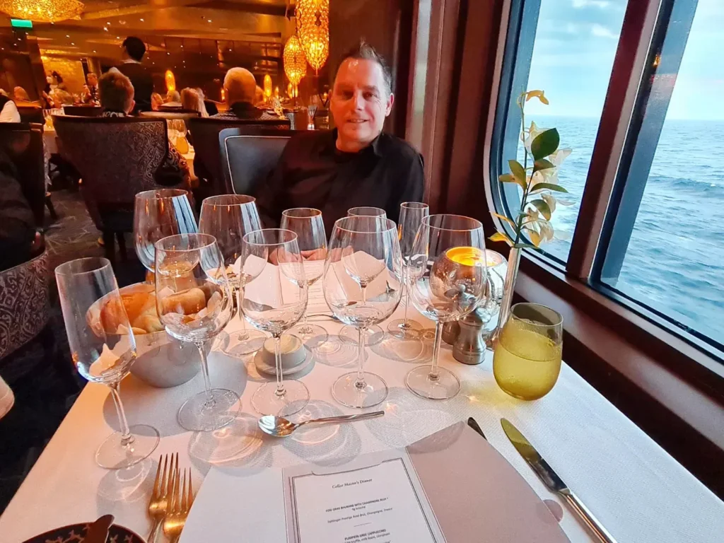 Cruising with Danny and Peter, Holland America Line, Rotterdam, Atlantic Ocean, Sea Day | Guests enjoying the exclusive Cellar Master Dinner aboard Holland America, featuring gourmet dishes, wine pairings, and an unforgettable luxury cruise dining experience.