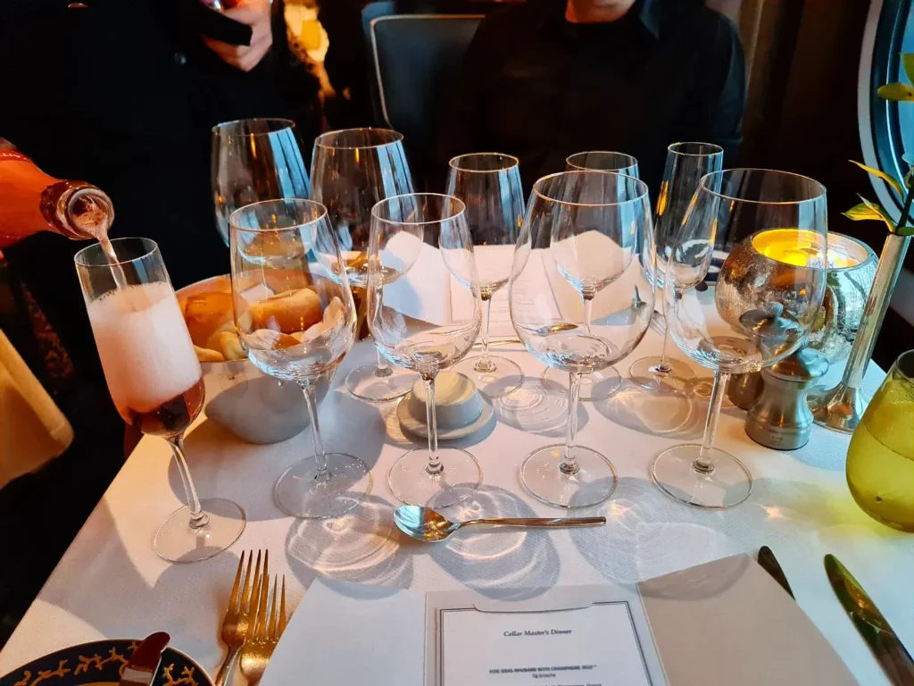 Cruising with Danny and Peter, Holland America Line, Rotterdam, Atlantic Ocean, Sea Day | Guests enjoying the exclusive Cellar Master Dinner aboard Holland America, featuring gourmet dishes, wine pairings, and an unforgettable luxury cruise dining experience.