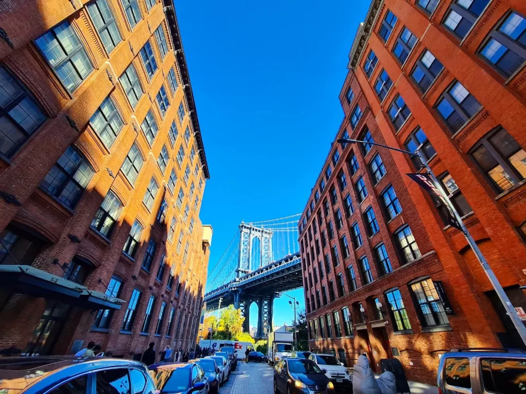 Cruising with Danny and Peter, Holland America Line, Rotterdam, New York, United States | Stunning views of the Brooklyn Bridge and Manhattan skyline during a New York City adventure, exploring iconic NYC bridges and 9/11 Memorial with panoramic views from the One World Observatory, capturing the vibrant energy of Times Square attractions and the historic NYC Financial District tour.