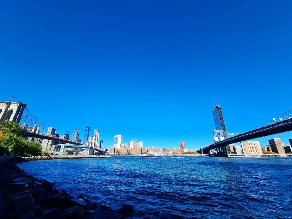 Cruising with Danny and Peter, Holland America Line, Rotterdam, New York, United States | Stunning views of the Brooklyn Bridge and Manhattan skyline during a New York City adventure, exploring iconic NYC bridges and 9/11 Memorial with panoramic views from the One World Observatory, capturing the vibrant energy of Times Square attractions and the historic NYC Financial District tour.