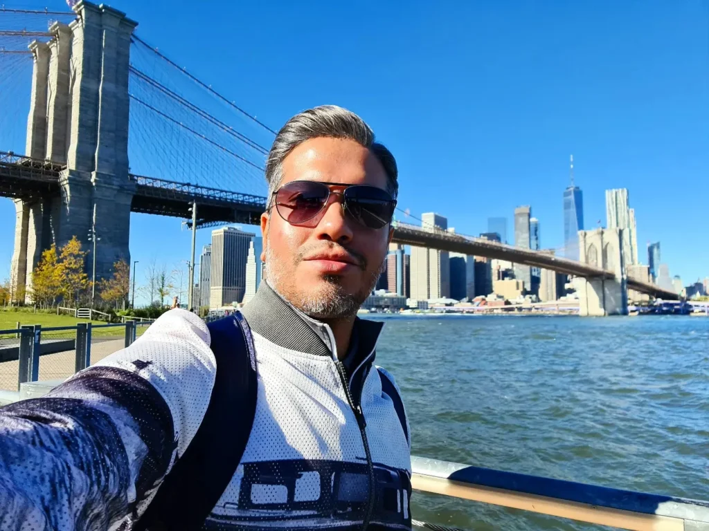 Cruising with Danny and Peter, Holland America Line, Rotterdam, New York, United States | Stunning views of the Brooklyn Bridge and Manhattan skyline during a New York City adventure, exploring iconic NYC bridges and 9/11 Memorial with panoramic views from the One World Observatory, capturing the vibrant energy of Times Square attractions and the historic NYC Financial District tour.