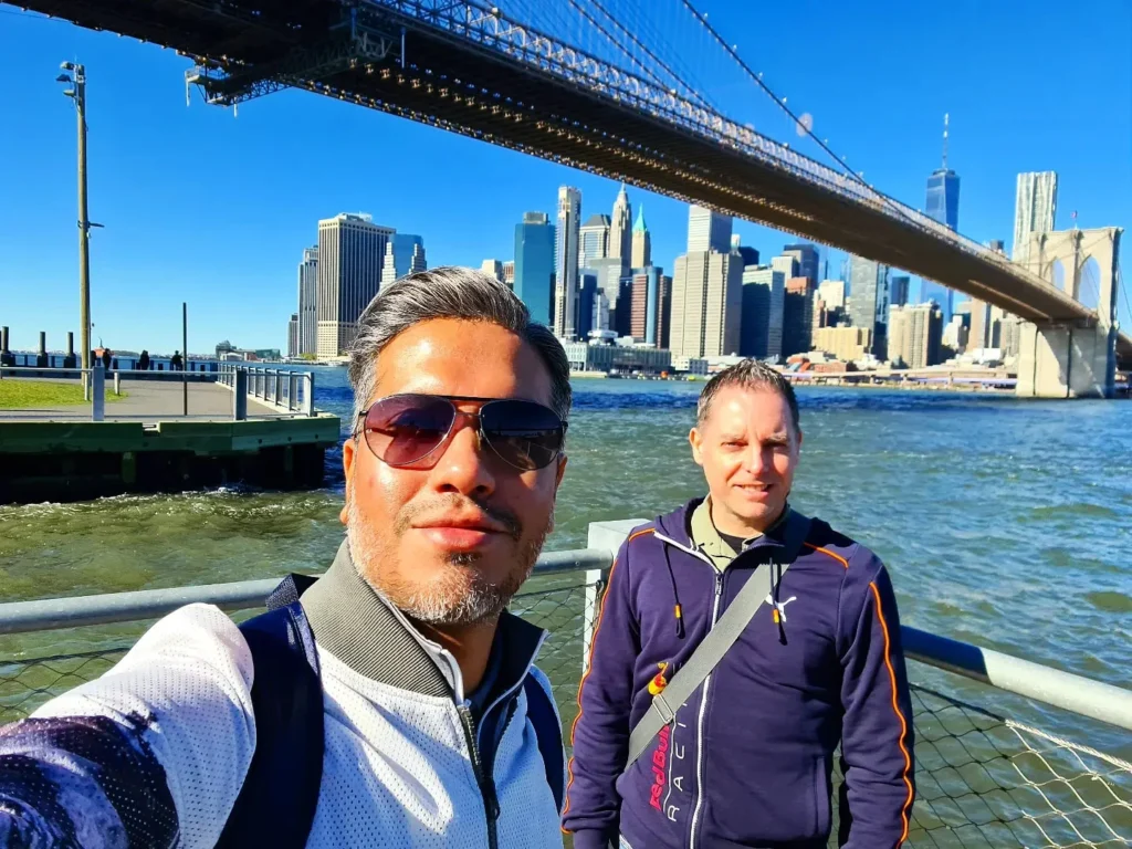 Cruising with Danny and Peter, Holland America Line, Rotterdam, New York, United States | Stunning views of the Brooklyn Bridge and Manhattan skyline during a New York City adventure, exploring iconic NYC bridges and 9/11 Memorial with panoramic views from the One World Observatory, capturing the vibrant energy of Times Square attractions and the historic NYC Financial District tour.