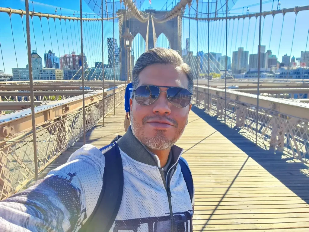 Cruising with Danny and Peter, Holland America Line, Rotterdam, New York, United States | Stunning views of the Brooklyn Bridge and Manhattan skyline during a New York City adventure, exploring iconic NYC bridges and 9/11 Memorial with panoramic views from the One World Observatory, capturing the vibrant energy of Times Square attractions and the historic NYC Financial District tour.