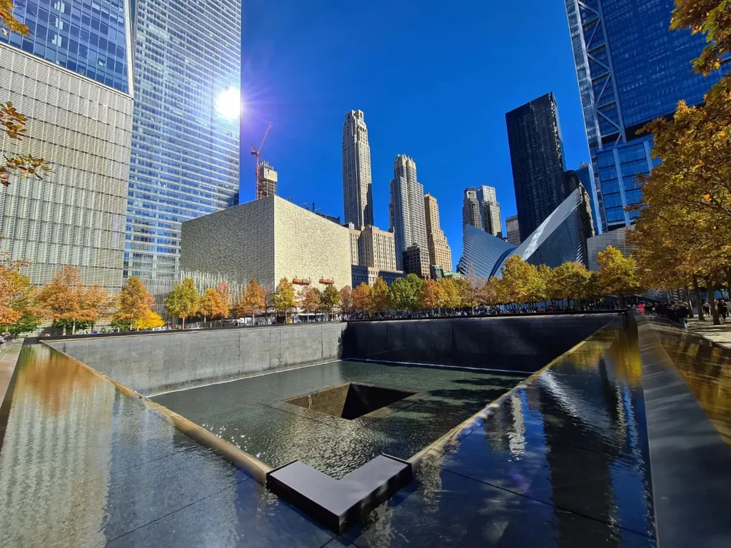 Cruising with Danny and Peter, Holland America Line, Rotterdam, New York, United States | Stunning views of the Brooklyn Bridge and Manhattan skyline during a New York City adventure, exploring iconic NYC bridges and 9/11 Memorial with panoramic views from the One World Observatory, capturing the vibrant energy of Times Square attractions and the historic NYC Financial District tour.