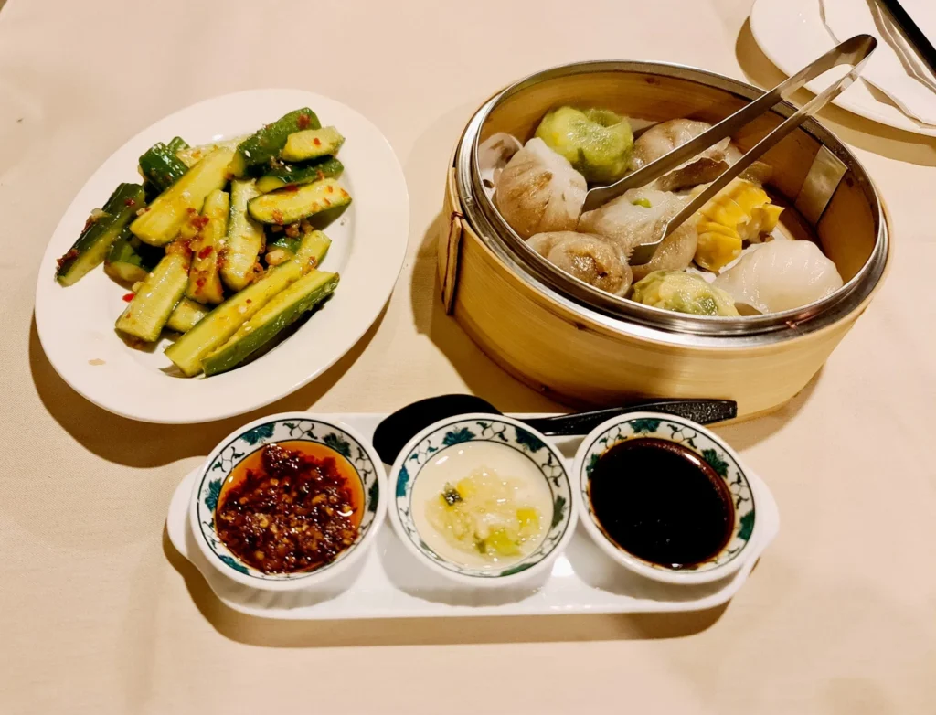 Cruising with Danny and Peter, Holland America Line, Rotterdam, New York, United States | Exploring Central Park New York on a sunny day, with scenic views of iconic landmarks like Bethesda Terrace and Bow Bridge, followed by a cultural visit to The Metropolitan Museum of Art showcasing masterpieces from Rembrandt, Van Gogh, and more.