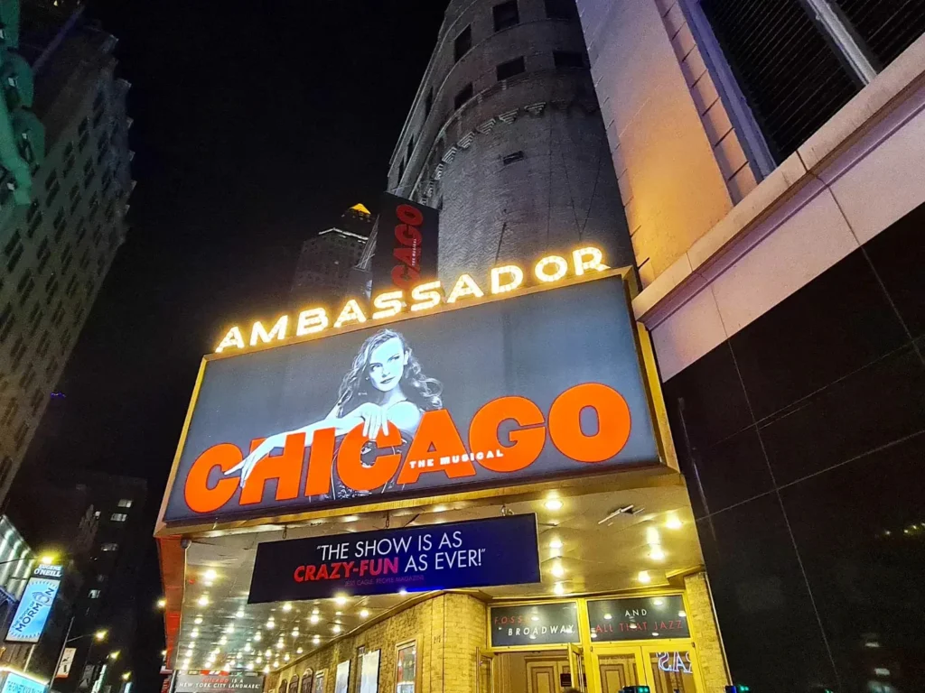 Cruising with Danny and Peter, Holland America Line, Rotterdam, New York, United States | New York Broadway experience with front row seats at Chicago on Broadway, featuring Angelica Ross as Roxie, stunning views from The Edge observation deck NYC, the iconic Hudson Yards Vessel, and a scenic stroll through High Line and Little Island. The vibrant Times Square at night and a delicious Chelsea Market food tour complete this unforgettable adventure.