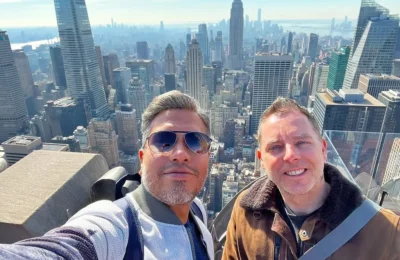 Cruising with Danny and Peter, Holland America Line, Rotterdam, New York, United States | View of iconic New York City landmarks including the Top of the Rock, Saint Patrick's Cathedral, MoMA, and the Flatiron Building, showcasing famous NYC art museums and historic monuments.