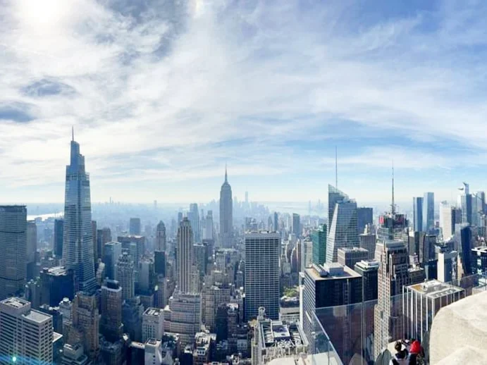 Cruising with Danny and Peter, Holland America Line, Rotterdam, New York, United States | View of iconic New York City landmarks including the Top of the Rock, Saint Patrick's Cathedral, MoMA, and the Flatiron Building, showcasing famous NYC art museums and historic monuments.