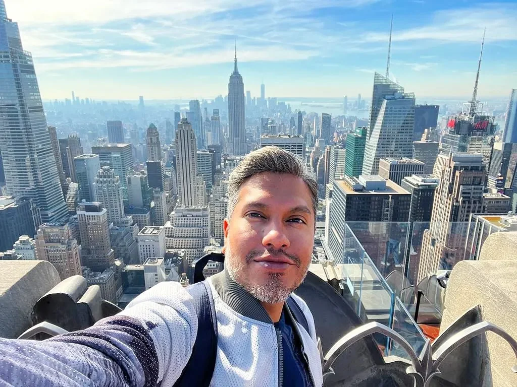Cruising with Danny and Peter, Holland America Line, Rotterdam, New York, United States | View of iconic New York City landmarks including the Top of the Rock, Saint Patrick's Cathedral, MoMA, and the Flatiron Building, showcasing famous NYC art museums and historic monuments.