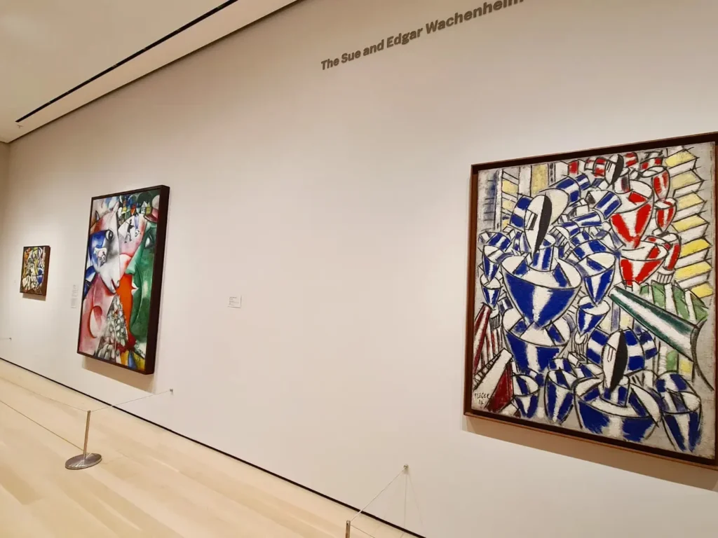 Cruising with Danny and Peter, Holland America Line, Rotterdam, New York, United States | View of iconic New York City landmarks including the Top of the Rock, Saint Patrick's Cathedral, MoMA, and the Flatiron Building, showcasing famous NYC art museums and historic monuments.