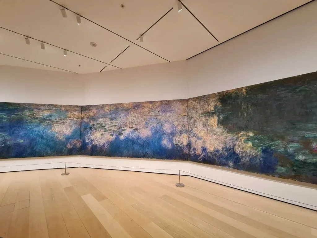 Cruising with Danny and Peter, Holland America Line, Rotterdam, New York, United States | View of iconic New York City landmarks including the Top of the Rock, Saint Patrick's Cathedral, MoMA, and the Flatiron Building, showcasing famous NYC art museums and historic monuments.