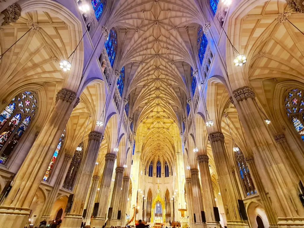 Cruising with Danny and Peter, Holland America Line, Rotterdam, New York, United States | View of iconic New York City landmarks including the Top of the Rock, Saint Patrick's Cathedral, MoMA, and the Flatiron Building, showcasing famous NYC art museums and historic monuments.