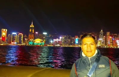 Cruising with Danny and Peter, Holland America Line, Westerdam, Hong Kong, China | Stunning view of the Symphony of Lights at Victoria Harbor Hong Kong, showcasing the Hong Kong skyline illumination with vibrant lights dancing across Victoria Harbour. A Harbor night light display featuring synchronized music, laser beams, and breathtaking visuals. The iconic Victoria Harbour waterfront show highlights the Hong Kong laser show and Skyscraper light show Hong Kong, creating a mesmerizing Hong Kong evening light spectacle that reflects the city's cultural richness. Experience the City lights performance Hong Kong as part of this Hong Kong cultural light show.