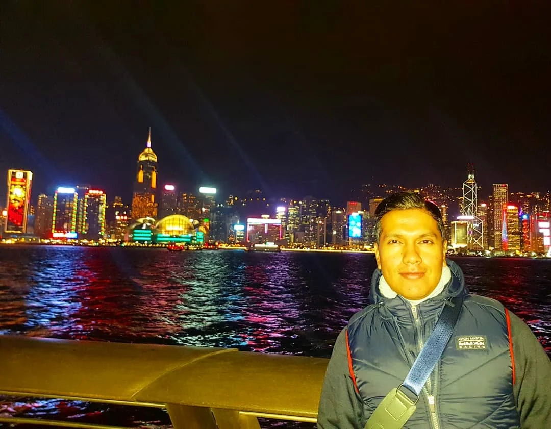 Cruising with Danny and Peter, Holland America Line, Westerdam, Hong Kong, China | Stunning view of the Symphony of Lights at Victoria Harbor Hong Kong, showcasing the Hong Kong skyline illumination with vibrant lights dancing across Victoria Harbour. A Harbor night light display featuring synchronized music, laser beams, and breathtaking visuals. The iconic Victoria Harbour waterfront show highlights the Hong Kong laser show and Skyscraper light show Hong Kong, creating a mesmerizing Hong Kong evening light spectacle that reflects the city's cultural richness. Experience the City lights performance Hong Kong as part of this Hong Kong cultural light show.