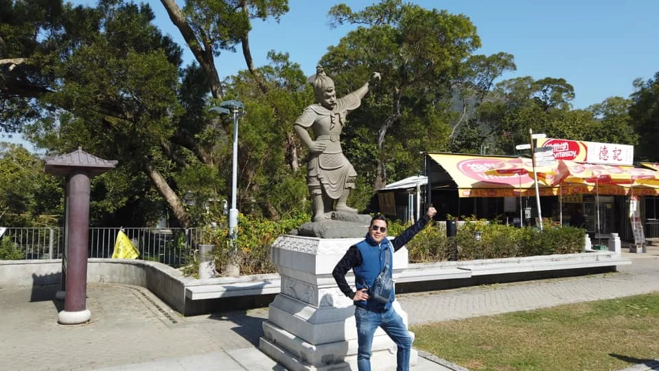Cruising with Danny and Peter, Holland America Line, Westerdam, Hong Kong, China | A breathtaking view from Ngong Ping 360 cable car showcasing lush landscapes and the South China Sea, capturing the serene beauty of Lantau Island. A majestic shot of the Tian Tan Buddha, surrounded by the tranquil Po Lin Monastery, illustrating the cultural richness of Hong Kong. The vibrant skyline of Hong Kong from Victoria Peak, highlighting the dynamic cityscape during sunset, with twinkling lights illuminating the urban landscape, representing the perfect blend of nature and urbanity in these unforgettable Hong Kong Adventures.
