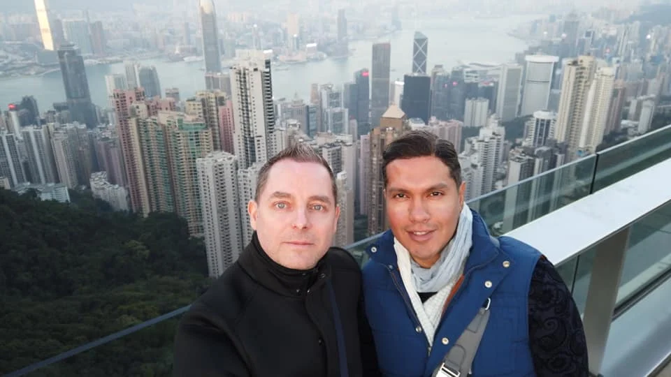 Cruising with Danny and Peter, Holland America Line, Westerdam, Hong Kong, China | A breathtaking view from Ngong Ping 360 cable car showcasing lush landscapes and the South China Sea, capturing the serene beauty of Lantau Island. A majestic shot of the Tian Tan Buddha, surrounded by the tranquil Po Lin Monastery, illustrating the cultural richness of Hong Kong. The vibrant skyline of Hong Kong from Victoria Peak, highlighting the dynamic cityscape during sunset, with twinkling lights illuminating the urban landscape, representing the perfect blend of nature and urbanity in these unforgettable Hong Kong Adventures.