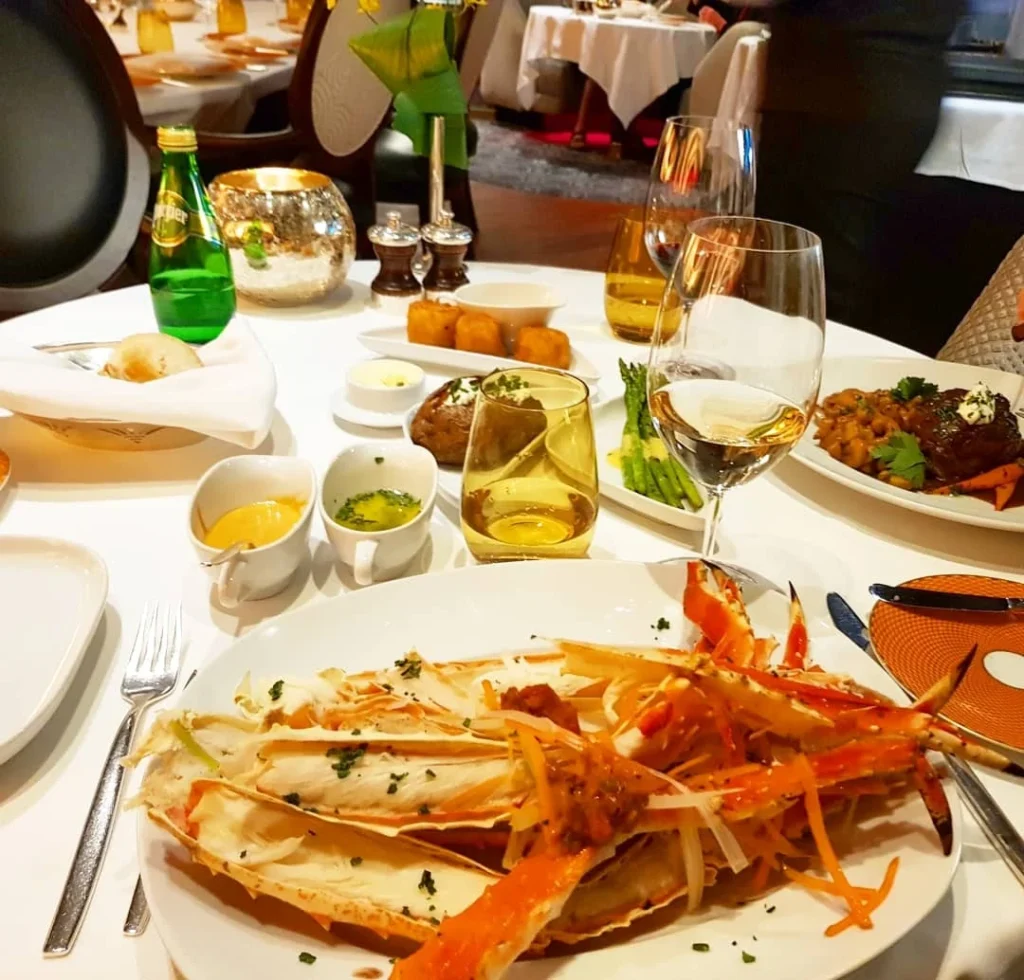 Xiamen Cruise Port: Our Complete Guide + Insider Tips 2026 (Visited Once in 2019 by Danny and Peter) 24 Cruising with Danny and Peter, Holland America Line, Westerdam, Xiamen, China | Exterior and interior views of Fujian Tulou, featuring traditional Hakka earthen architecture and intricate wooden carvings. Showcasing scenic Fujian Province landscapes and communal living structures at the UNESCO World Heritage site in Xiamen.