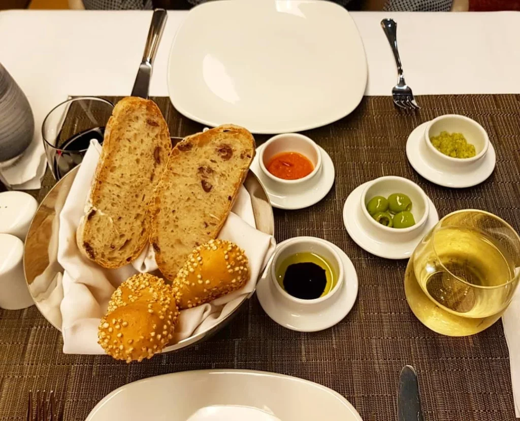 Xiamen Cruise Port: Our Complete Guide + Insider Tips 2026 (Visited Once in 2019 by Danny and Peter) 32 Cruising with Danny and Peter, Holland America Line, Westerdam, Xiamen, China | Exterior and interior views of Fujian Tulou, featuring traditional Hakka earthen architecture and intricate wooden carvings. Showcasing scenic Fujian Province landscapes and communal living structures at the UNESCO World Heritage site in Xiamen.