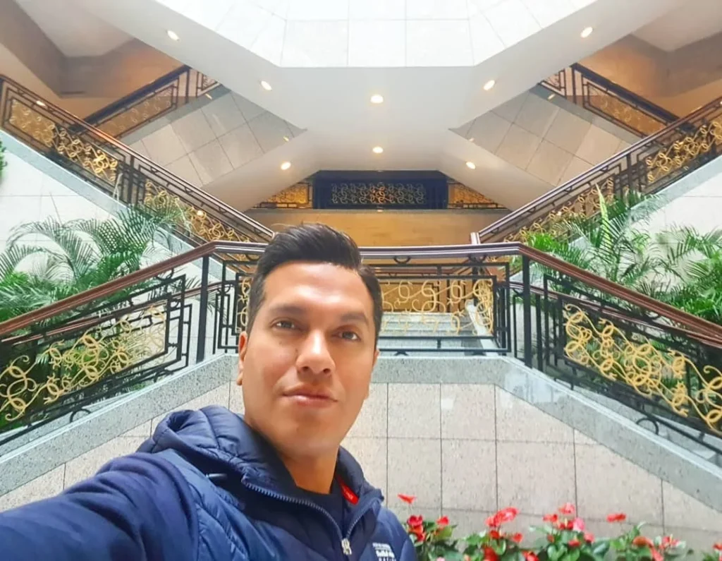 Cruising with Danny and Peter, Holland America Line, Westerdam, Shanghai, China | A guide leading a group through historic landmarks in Shanghai, showcasing the vibrant cityscape, modern skyscrapers, and traditional architecture. The group enjoys a Chinese tea ceremony, tasting various teas in a serene teahouse, capturing the essence of an unforgettable Shanghai Private Tour and Tea Tasting Experience.