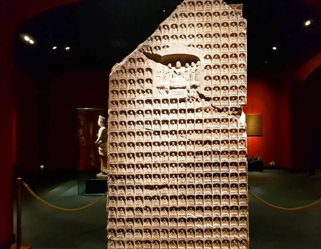 Cruising with Danny and Peter, Holland America Line, Westerdam, Shanghai, China | A guide leading a group through historic landmarks in Shanghai, showcasing the vibrant cityscape, modern skyscrapers, and traditional architecture. The group enjoys a Chinese tea ceremony, tasting various teas in a serene teahouse, capturing the essence of an unforgettable Shanghai Private Tour and Tea Tasting Experience.