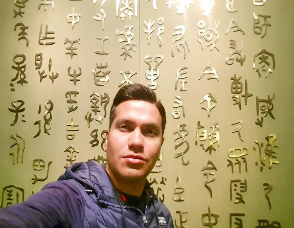 Cruising with Danny and Peter, Holland America Line, Westerdam, Shanghai, China | A guide leading a group through historic landmarks in Shanghai, showcasing the vibrant cityscape, modern skyscrapers, and traditional architecture. The group enjoys a Chinese tea ceremony, tasting various teas in a serene teahouse, capturing the essence of an unforgettable Shanghai Private Tour and Tea Tasting Experience.