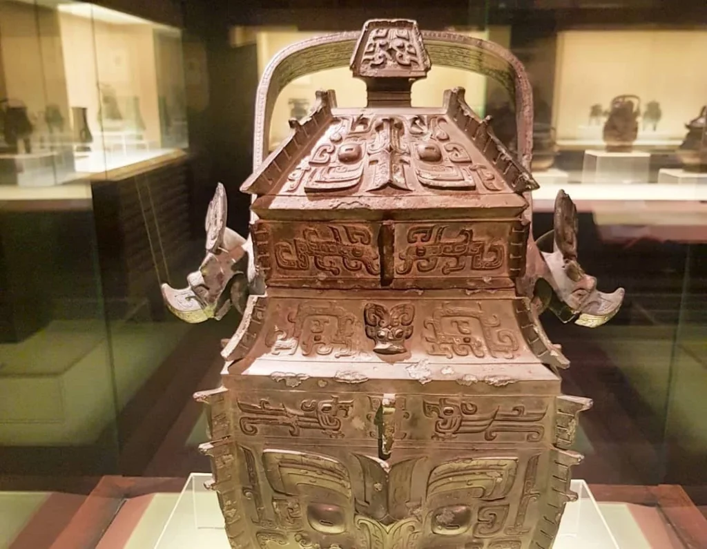 Cruising with Danny and Peter, Holland America Line, Westerdam, Shanghai, China | A guide leading a group through historic landmarks in Shanghai, showcasing the vibrant cityscape, modern skyscrapers, and traditional architecture. The group enjoys a Chinese tea ceremony, tasting various teas in a serene teahouse, capturing the essence of an unforgettable Shanghai Private Tour and Tea Tasting Experience.