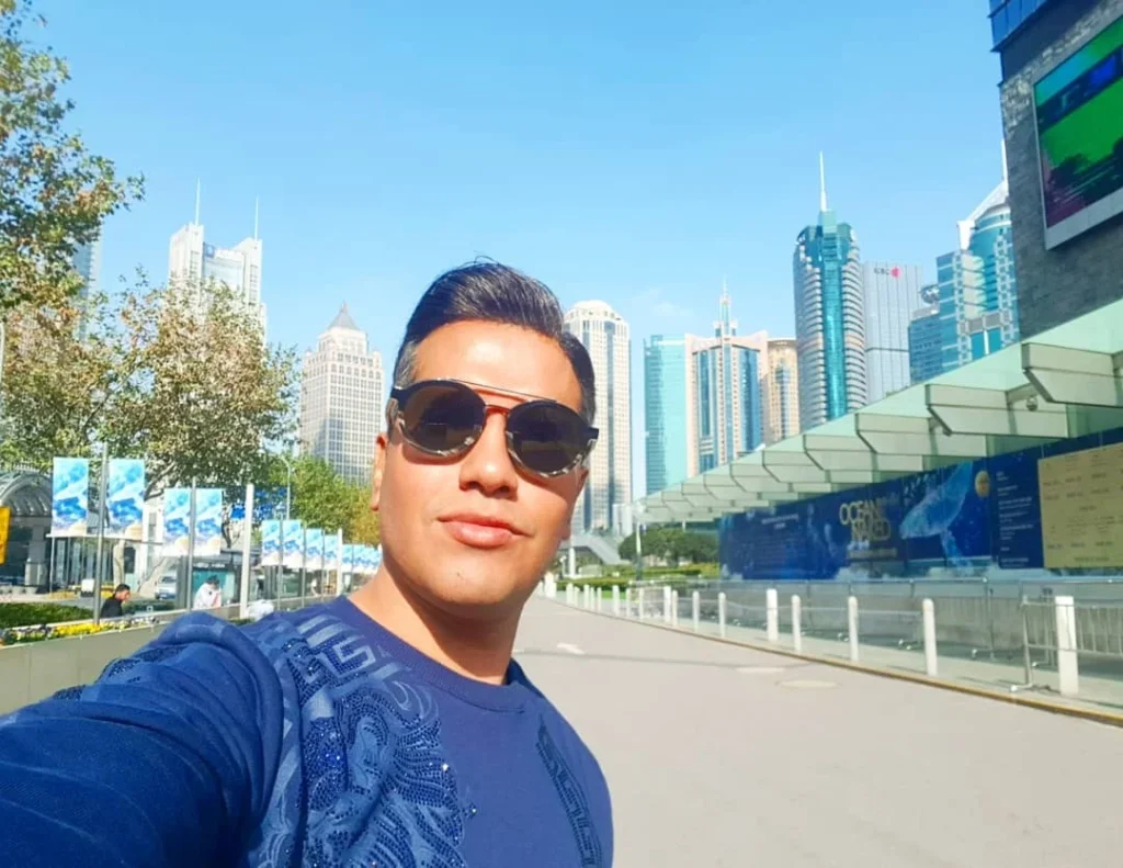 Cruising with Danny and Peter, Holland America Line, Westerdam, Shanghai, China | A guide leading a group through historic landmarks in Shanghai, showcasing the vibrant cityscape, modern skyscrapers, and traditional architecture. The group enjoys a Chinese tea ceremony, tasting various teas in a serene teahouse, capturing the essence of an unforgettable Shanghai Private Tour and Tea Tasting Experience.