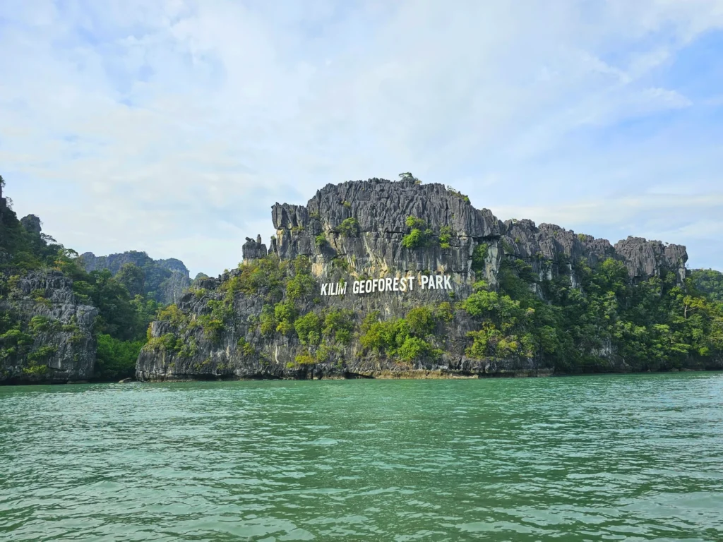 Cruising with Danny and Peter, Holland America Line, Westerdam, Porto Malai, Langkawi, Malaysia | Scenic views of Porto Malai Marina with yachts, private boat cruising through Kilim Karst Geoforest's mangroves, majestic eagles soaring above, and panoramic vistas from the Langkawi Sky Bridge and Cable Car overlooking lush rainforests and the Andaman Sea during a Langkawi Day Trip.