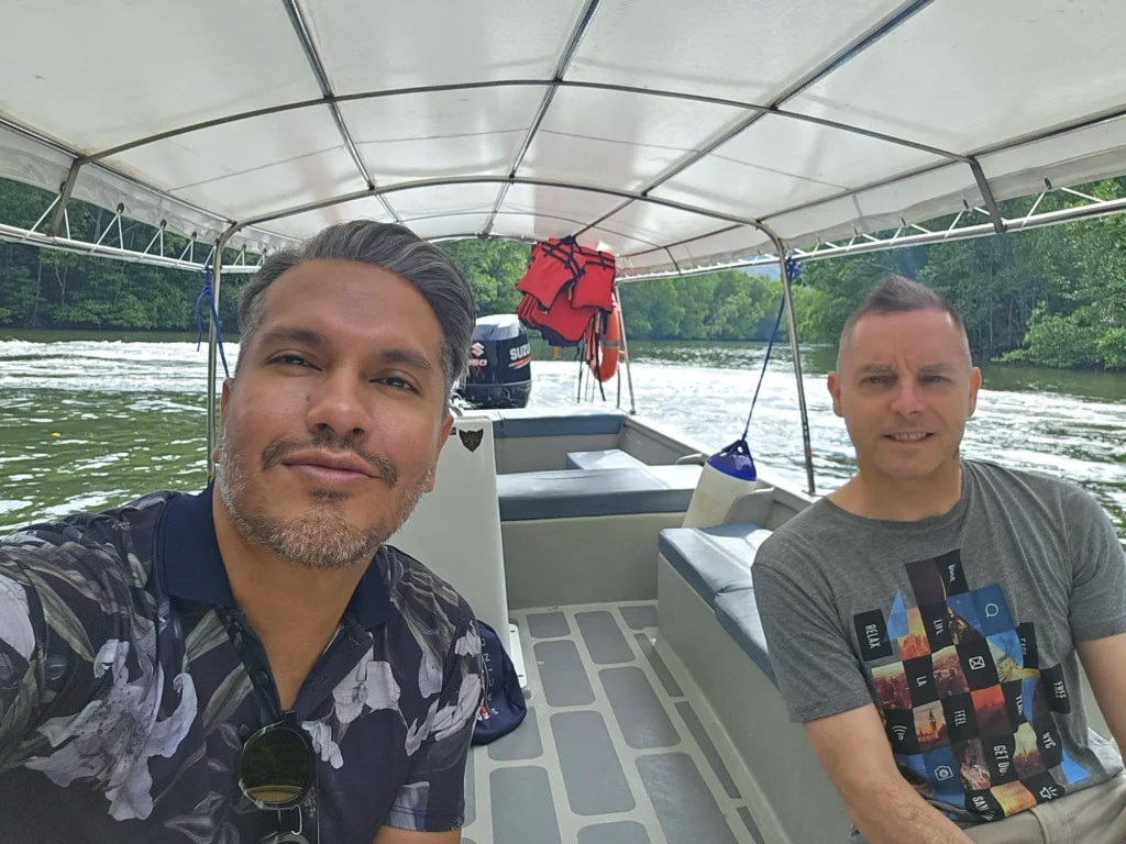 Cruising with Danny and Peter, Holland America Line, Westerdam, Porto Malai, Langkawi, Malaysia | Scenic views of Porto Malai Marina with yachts, private boat cruising through Kilim Karst Geoforest's mangroves, majestic eagles soaring above, and panoramic vistas from the Langkawi Sky Bridge and Cable Car overlooking lush rainforests and the Andaman Sea during a Langkawi Day Trip.