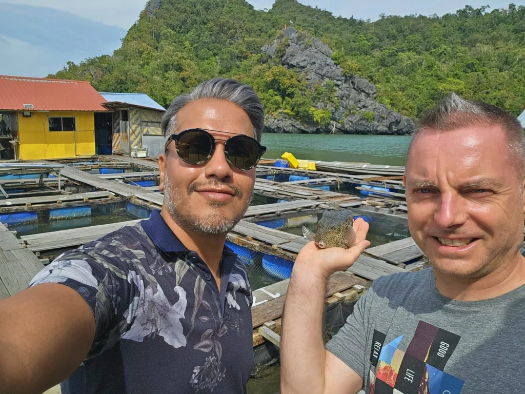 Cruising with Danny and Peter, Holland America Line, Westerdam, Porto Malai, Langkawi, Malaysia | Scenic views of Porto Malai Marina with yachts, private boat cruising through Kilim Karst Geoforest's mangroves, majestic eagles soaring above, and panoramic vistas from the Langkawi Sky Bridge and Cable Car overlooking lush rainforests and the Andaman Sea during a Langkawi Day Trip.