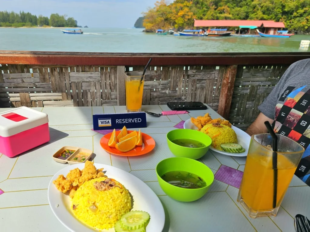 Cruising with Danny and Peter, Holland America Line, Westerdam, Porto Malai, Langkawi, Malaysia | Scenic views of Porto Malai Marina with yachts, private boat cruising through Kilim Karst Geoforest's mangroves, majestic eagles soaring above, and panoramic vistas from the Langkawi Sky Bridge and Cable Car overlooking lush rainforests and the Andaman Sea during a Langkawi Day Trip.