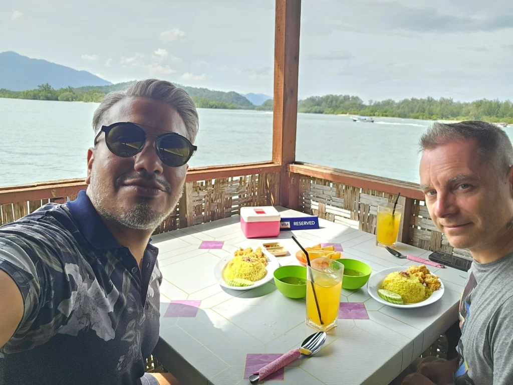 Cruising with Danny and Peter, Holland America Line, Westerdam, Porto Malai, Langkawi, Malaysia | Scenic views of Porto Malai Marina with yachts, private boat cruising through Kilim Karst Geoforest's mangroves, majestic eagles soaring above, and panoramic vistas from the Langkawi Sky Bridge and Cable Car overlooking lush rainforests and the Andaman Sea during a Langkawi Day Trip.