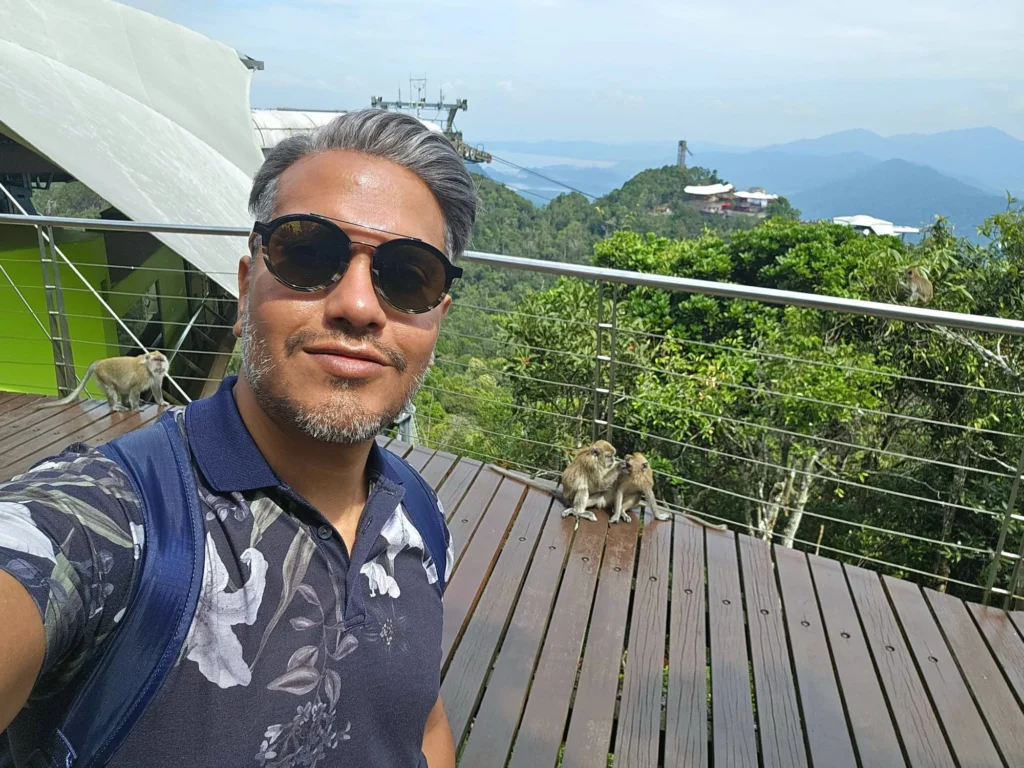 Cruising with Danny and Peter, Holland America Line, Westerdam, Porto Malai, Langkawi, Malaysia | Scenic views of Porto Malai Marina with yachts, private boat cruising through Kilim Karst Geoforest's mangroves, majestic eagles soaring above, and panoramic vistas from the Langkawi Sky Bridge and Cable Car overlooking lush rainforests and the Andaman Sea during a Langkawi Day Trip.