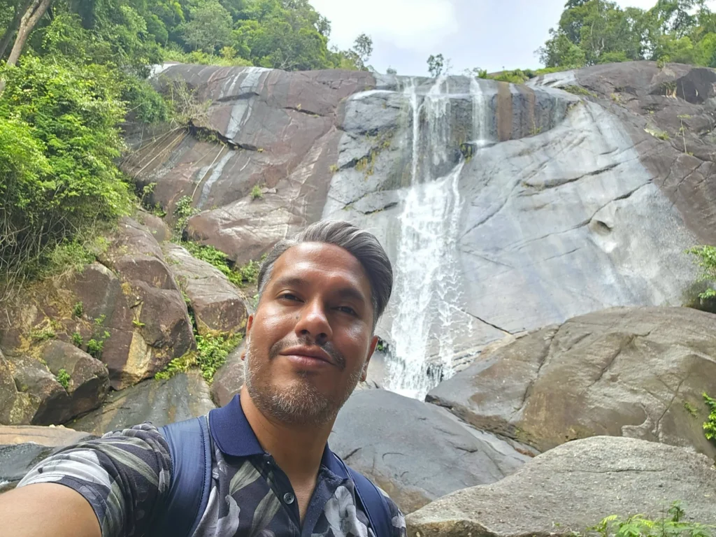 Cruising with Danny and Peter, Holland America Line, Westerdam, Porto Malai, Langkawi, Malaysia | Scenic views of Porto Malai Marina with yachts, private boat cruising through Kilim Karst Geoforest's mangroves, majestic eagles soaring above, and panoramic vistas from the Langkawi Sky Bridge and Cable Car overlooking lush rainforests and the Andaman Sea during a Langkawi Day Trip.