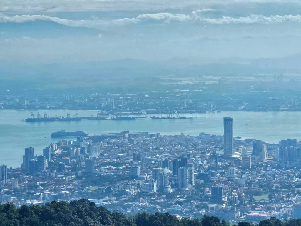 Cruising with Danny and Peter, Holland America Line, Westerdam, Penang, Malaysia | Explore Penang’s cultural treasures with the Kek Lok Si Temple’s intricate pagoda, Wat Chaiya Mangkalaram’s colossal reclining Buddha, Dhammikarama Burmese Temple’s golden structures, the ornate interior of Pinang Peranakan Mansion, the lush greenery of Penang Botanical Gardens, and the breathtaking panoramic views from Penang Hill.