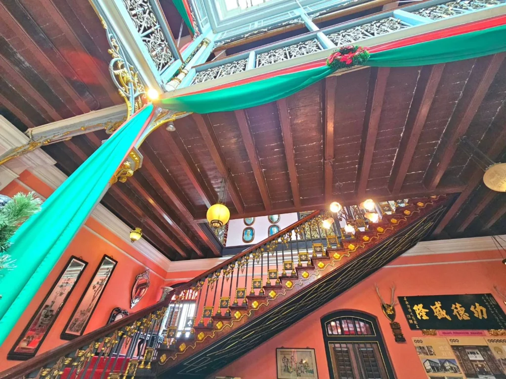 Cruising with Danny and Peter, Holland America Line, Westerdam, Penang, Malaysia | Explore Penang’s cultural treasures with the Kek Lok Si Temple’s intricate pagoda, Wat Chaiya Mangkalaram’s colossal reclining Buddha, Dhammikarama Burmese Temple’s golden structures, the ornate interior of Pinang Peranakan Mansion, the lush greenery of Penang Botanical Gardens, and the breathtaking panoramic views from Penang Hill.