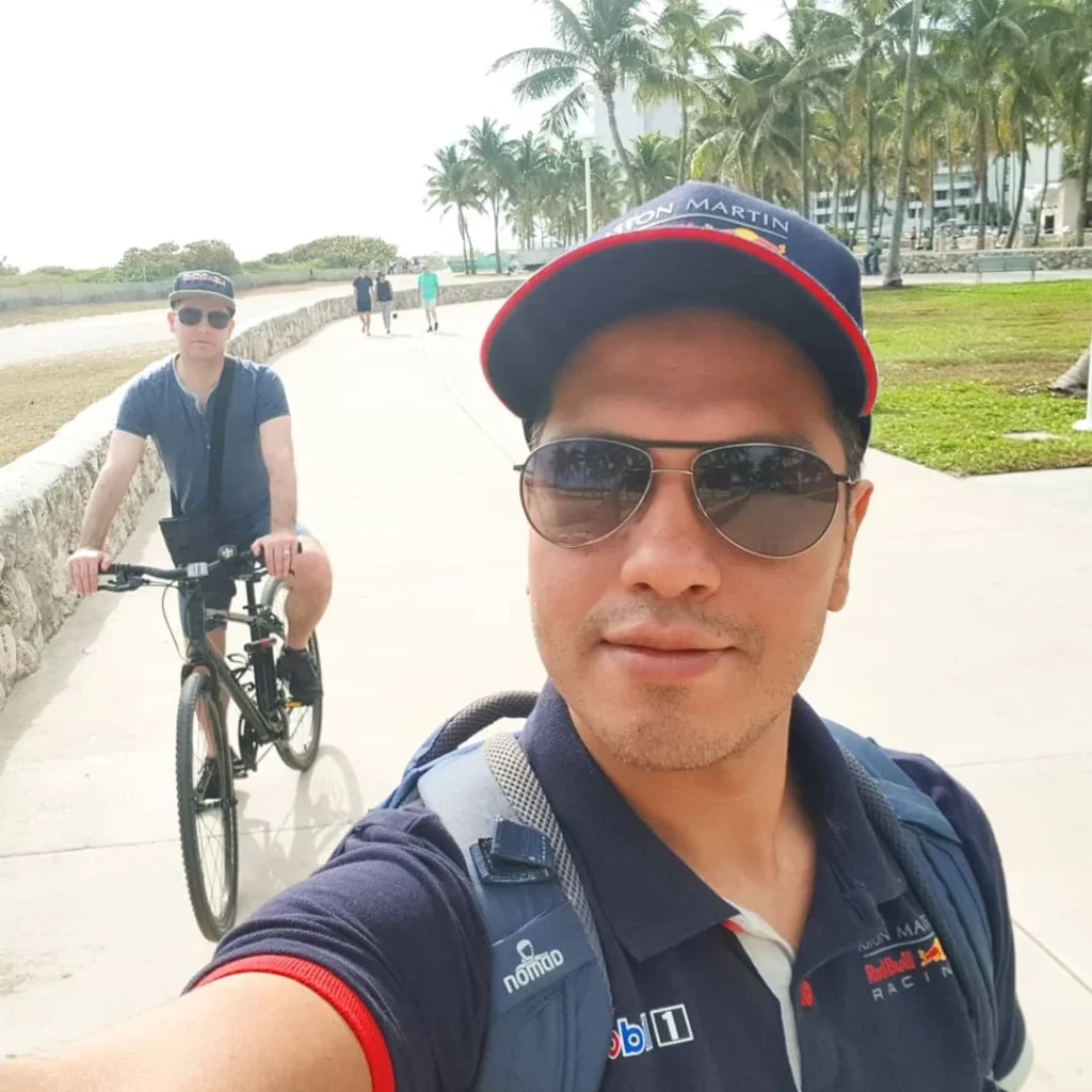 Cruising with Danny and Peter, Holland America Line, Zuiderdam, Miami, United States | Scenic Miami Beach bike ride along Ocean Drive, featuring cyclists on the South Beach bike path with views of Art Deco buildings, the boardwalk, and North Beach.