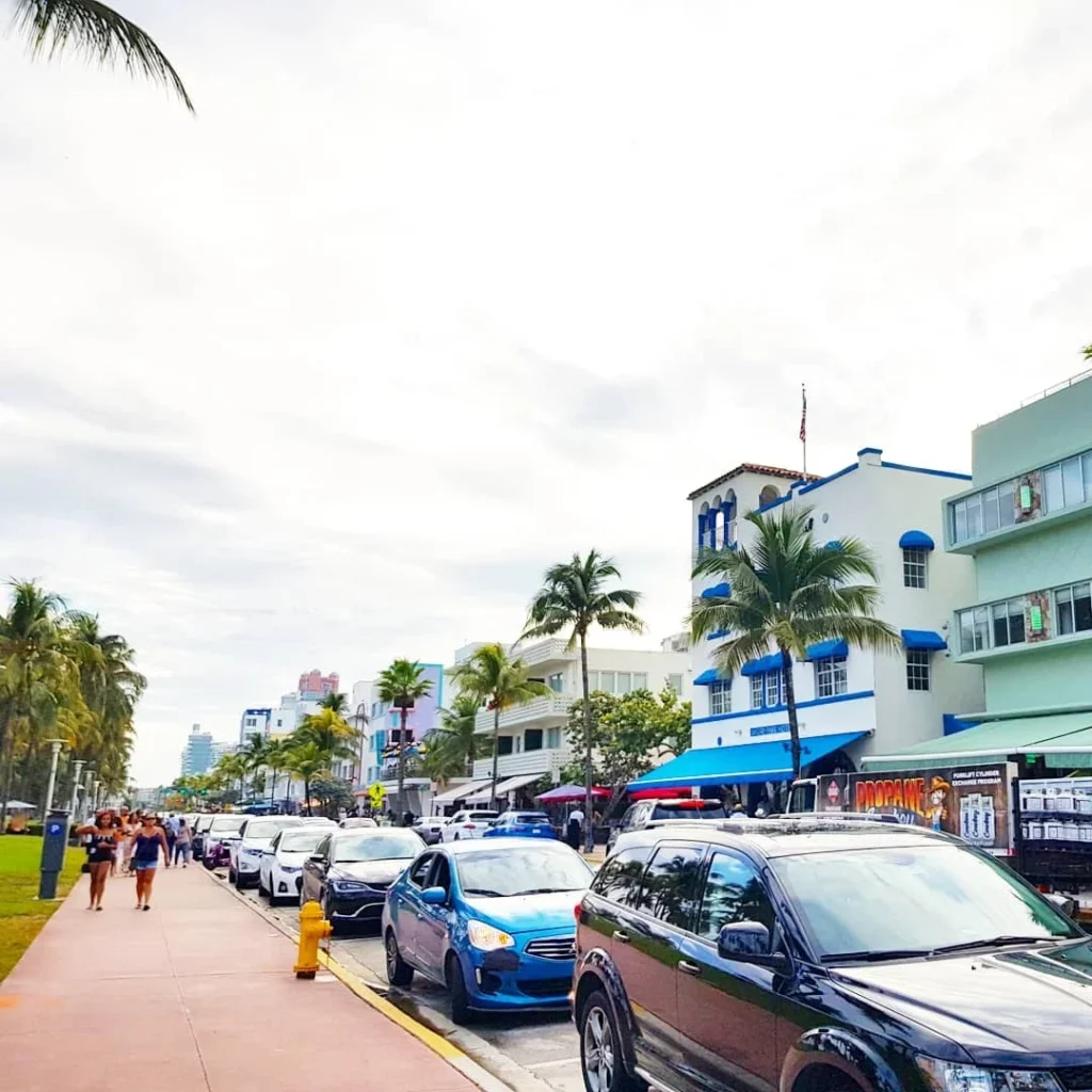 Cruising with Danny and Peter, Holland America Line, Zuiderdam, Miami, United States | Scenic Miami Beach bike ride along Ocean Drive, featuring cyclists on the South Beach bike path with views of Art Deco buildings, the boardwalk, and North Beach.