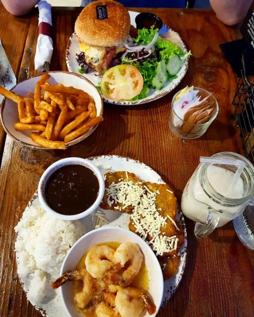 Cruising with Danny and Peter, Holland America Line, Zuiderdam, Miami, United States | Scenic Miami Beach bike ride along Ocean Drive, featuring cyclists on the South Beach bike path with views of Art Deco buildings, the boardwalk, and North Beach.