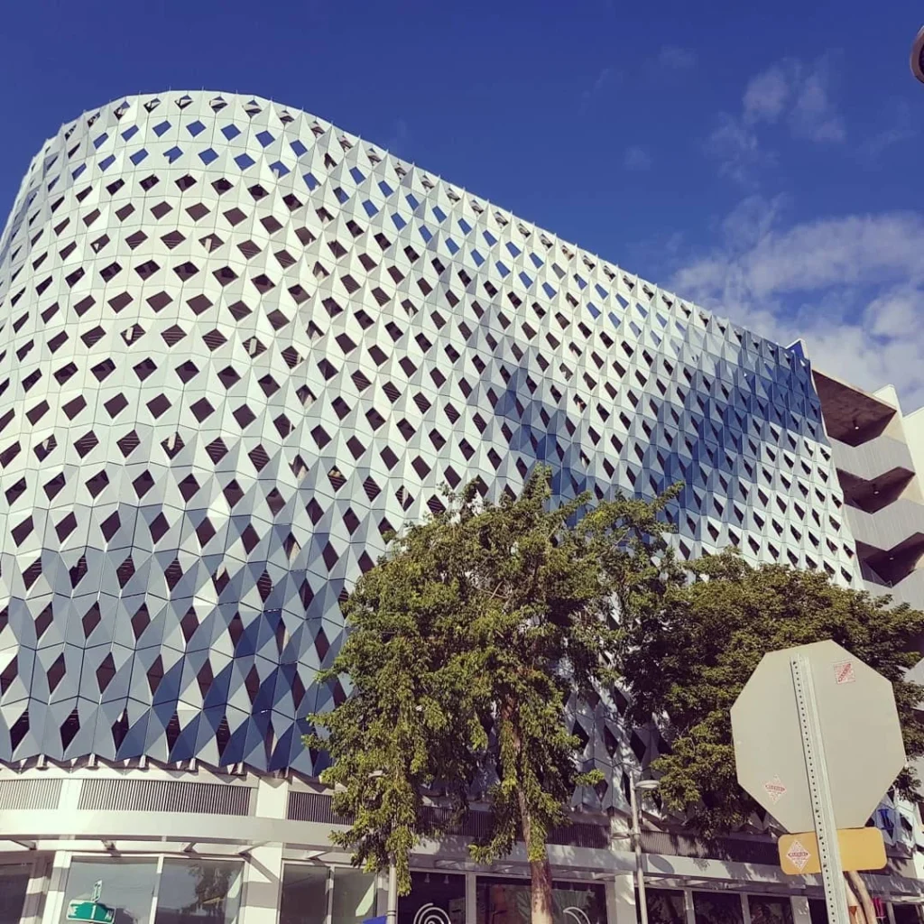 Cruising with Danny and Peter, Holland America Line, Zuiderdam, Miami, United States | Scenic Miami Beach bike ride along Ocean Drive, featuring cyclists on the South Beach bike path with views of Art Deco buildings, the boardwalk, and North Beach.