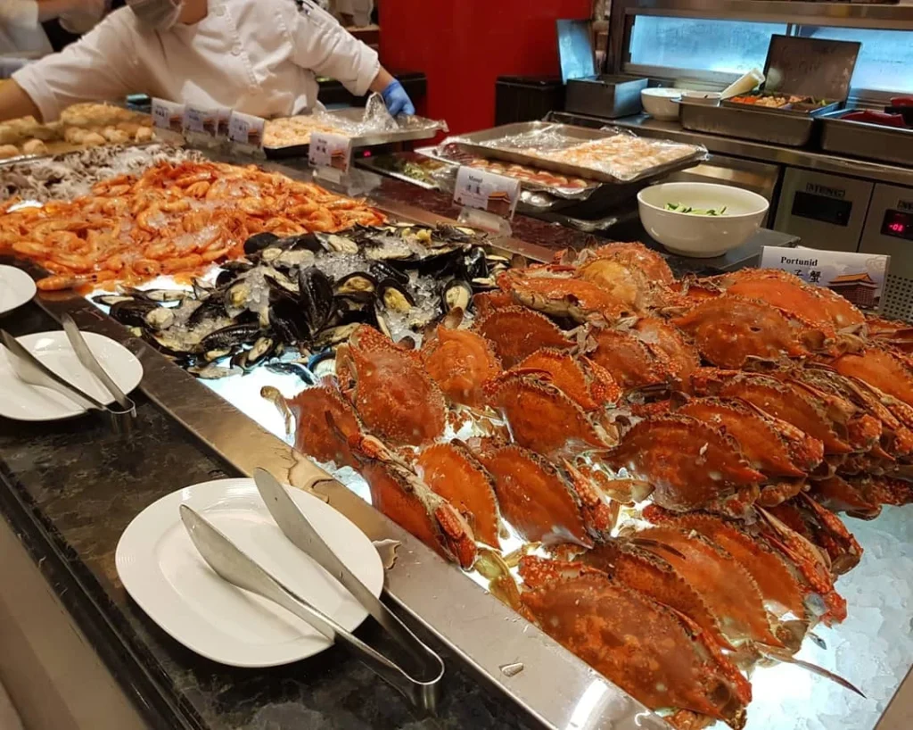 Keelung Taipei Cruise Port: Our Complete Guide + Insider Tips 2026 (Visited Once in 2019 by Danny and Peter) 16 Cruising with Danny and Peter, Holland America Line, Westerdam, Keelung, Taipei, Taiwan | Vibrant scene of Keelung Night Market showcasing diverse Taiwanese street food, including oyster pancakes and stinky tofu, with colorful stalls and lively crowds. Scenic views from Chaojing Park overlooking Keelung Harbor, featuring traditional architecture and lush landscapes. Picturesque images of Keelung Island attractions, highlighting pristine beaches and charming fishing villages, capturing the cultural heritage of Keelung and its rich maritime history.