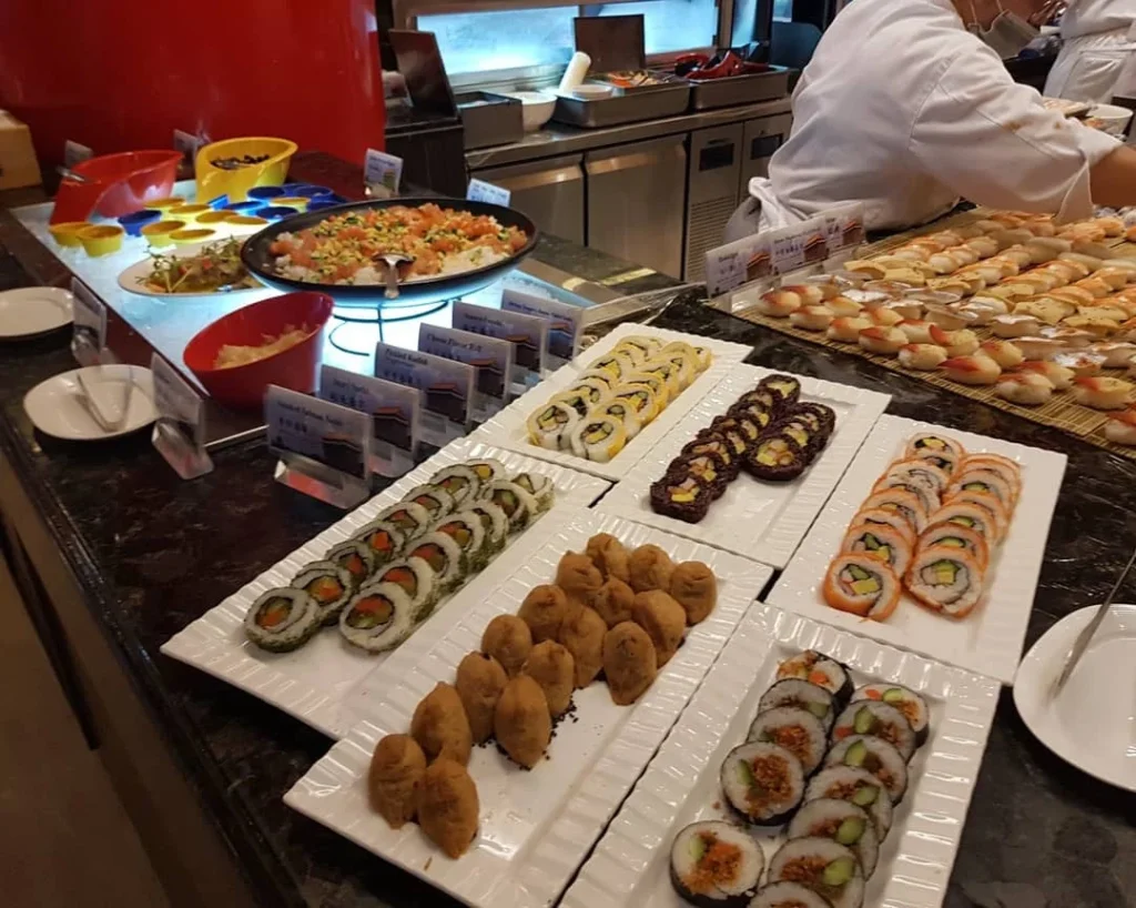 Keelung Taipei Cruise Port: Our Complete Guide + Insider Tips 2026 (Visited Once in 2019 by Danny and Peter) 17 Cruising with Danny and Peter, Holland America Line, Westerdam, Keelung, Taipei, Taiwan | Vibrant scene of Keelung Night Market showcasing diverse Taiwanese street food, including oyster pancakes and stinky tofu, with colorful stalls and lively crowds. Scenic views from Chaojing Park overlooking Keelung Harbor, featuring traditional architecture and lush landscapes. Picturesque images of Keelung Island attractions, highlighting pristine beaches and charming fishing villages, capturing the cultural heritage of Keelung and its rich maritime history.