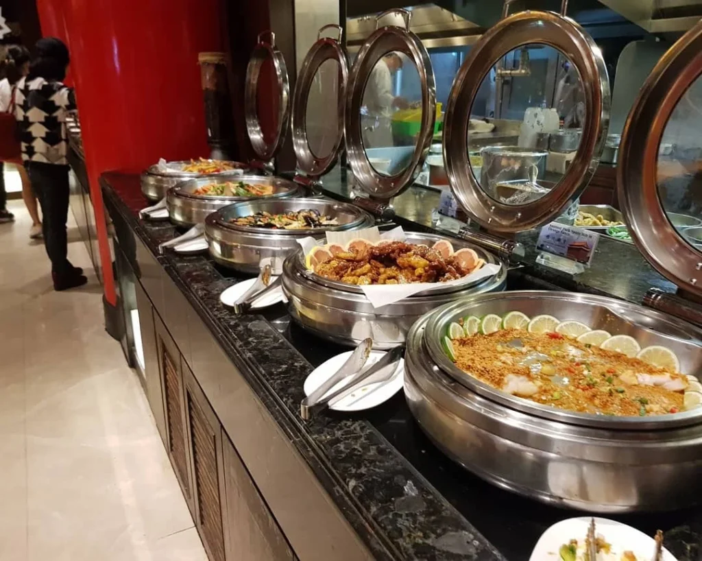 Keelung Taipei Cruise Port: Our Complete Guide + Insider Tips 2026 (Visited Once in 2019 by Danny and Peter) 18 Cruising with Danny and Peter, Holland America Line, Westerdam, Keelung, Taipei, Taiwan | Vibrant scene of Keelung Night Market showcasing diverse Taiwanese street food, including oyster pancakes and stinky tofu, with colorful stalls and lively crowds. Scenic views from Chaojing Park overlooking Keelung Harbor, featuring traditional architecture and lush landscapes. Picturesque images of Keelung Island attractions, highlighting pristine beaches and charming fishing villages, capturing the cultural heritage of Keelung and its rich maritime history.