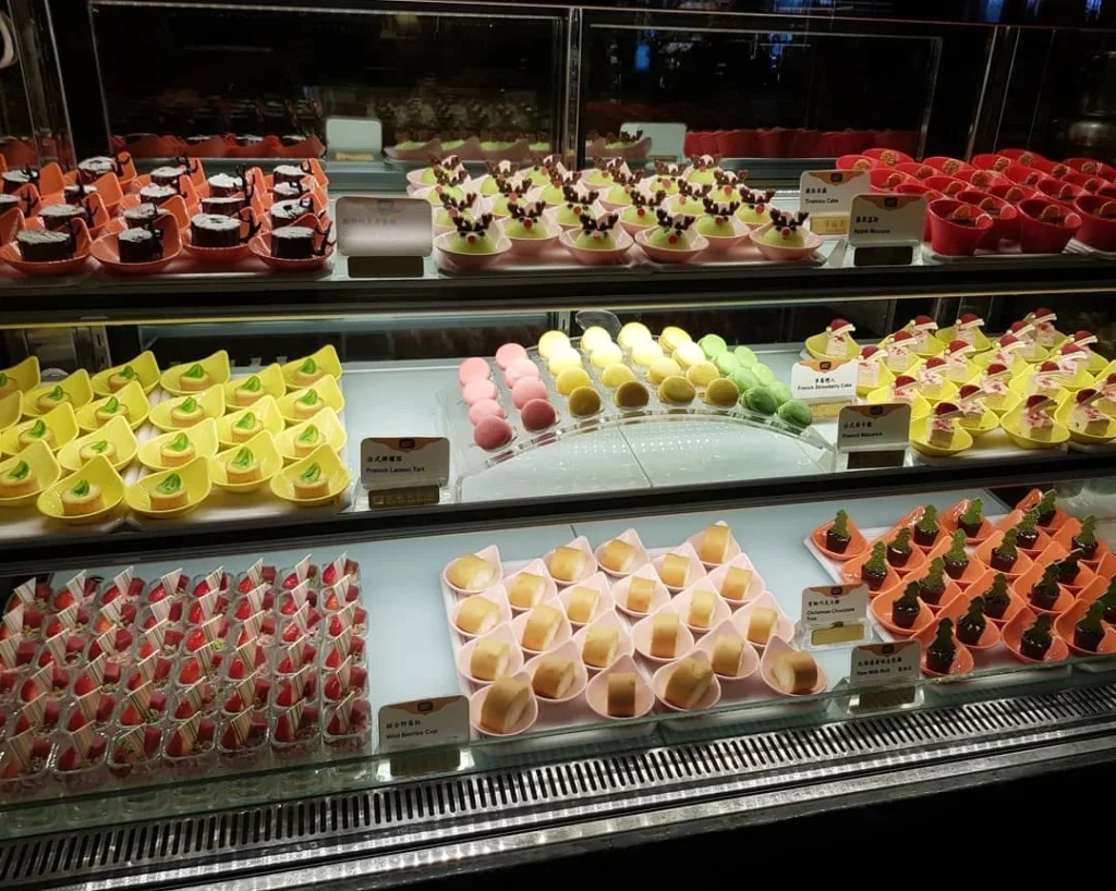 Keelung Taipei Cruise Port: Our Complete Guide + Insider Tips 2026 (Visited Once in 2019 by Danny and Peter) 19 Cruising with Danny and Peter, Holland America Line, Westerdam, Keelung, Taipei, Taiwan | Vibrant scene of Keelung Night Market showcasing diverse Taiwanese street food, including oyster pancakes and stinky tofu, with colorful stalls and lively crowds. Scenic views from Chaojing Park overlooking Keelung Harbor, featuring traditional architecture and lush landscapes. Picturesque images of Keelung Island attractions, highlighting pristine beaches and charming fishing villages, capturing the cultural heritage of Keelung and its rich maritime history.