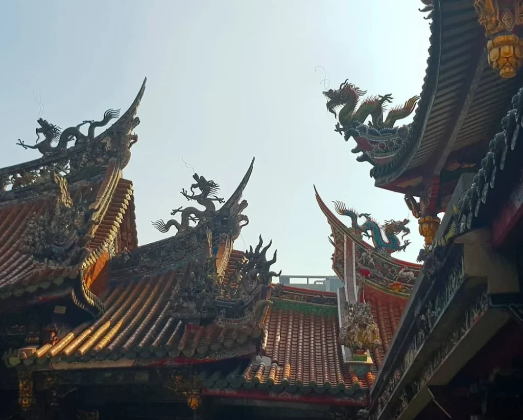 Keelung Taipei Cruise Port: Our Complete Guide + Insider Tips 2026 (Visited Once in 2019 by Danny and Peter) 24 Cruising with Danny and Peter, Holland America Line, Westerdam, Keelung, Taipei, Taiwan | Vibrant scene of Keelung Night Market showcasing diverse Taiwanese street food, including oyster pancakes and stinky tofu, with colorful stalls and lively crowds. Scenic views from Chaojing Park overlooking Keelung Harbor, featuring traditional architecture and lush landscapes. Picturesque images of Keelung Island attractions, highlighting pristine beaches and charming fishing villages, capturing the cultural heritage of Keelung and its rich maritime history.