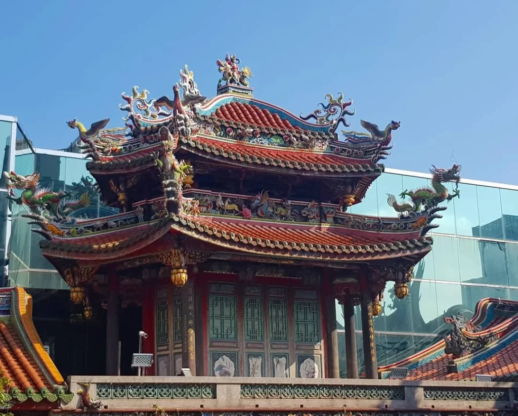 Keelung Taipei Cruise Port: Our Complete Guide + Insider Tips 2026 (Visited Once in 2019 by Danny and Peter) 29 Cruising with Danny and Peter, Holland America Line, Westerdam, Keelung, Taipei, Taiwan | Vibrant scene of Keelung Night Market showcasing diverse Taiwanese street food, including oyster pancakes and stinky tofu, with colorful stalls and lively crowds. Scenic views from Chaojing Park overlooking Keelung Harbor, featuring traditional architecture and lush landscapes. Picturesque images of Keelung Island attractions, highlighting pristine beaches and charming fishing villages, capturing the cultural heritage of Keelung and its rich maritime history.