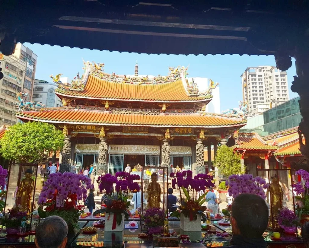 Keelung Taipei Cruise Port: Our Complete Guide + Insider Tips 2026 (Visited Once in 2019 by Danny and Peter) 31 Cruising with Danny and Peter, Holland America Line, Westerdam, Keelung, Taipei, Taiwan | Vibrant scene of Keelung Night Market showcasing diverse Taiwanese street food, including oyster pancakes and stinky tofu, with colorful stalls and lively crowds. Scenic views from Chaojing Park overlooking Keelung Harbor, featuring traditional architecture and lush landscapes. Picturesque images of Keelung Island attractions, highlighting pristine beaches and charming fishing villages, capturing the cultural heritage of Keelung and its rich maritime history.